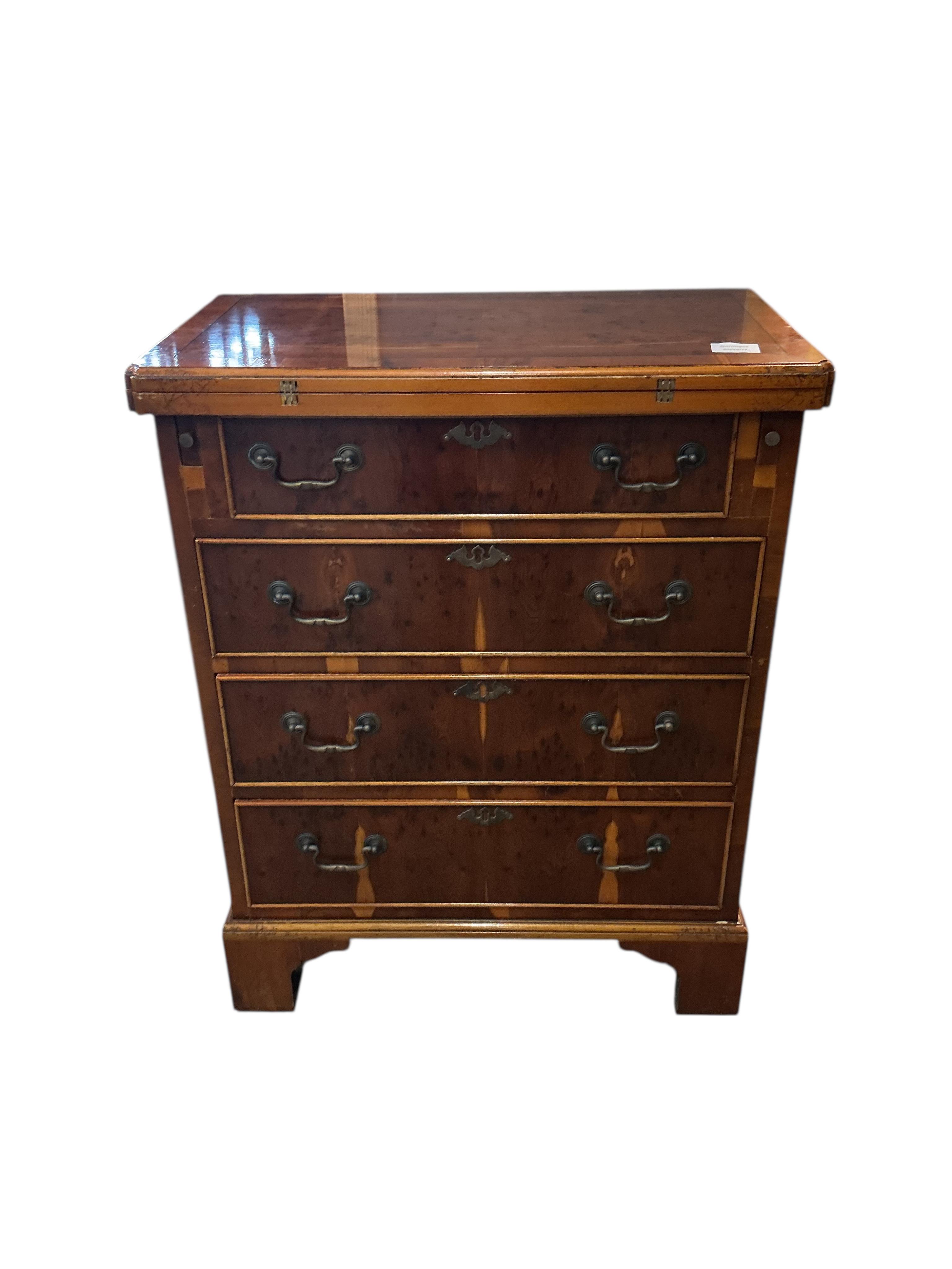 A small reproduction yew bachelor's chest, width 59cm, depth 34cm, height 76cm